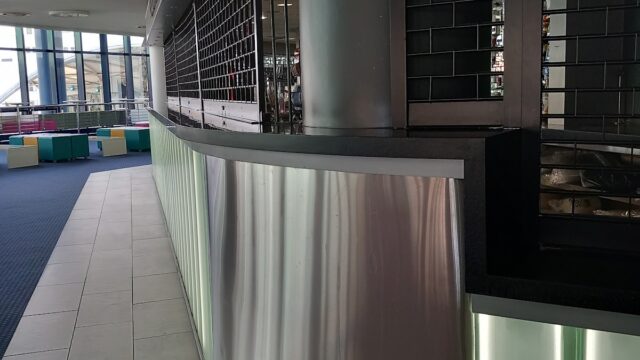 Metal sheeting on shop front and enclosure